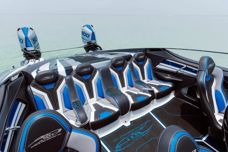  Yacht Photos Pics 2024 MTI 440X boat interior with blue and white seating, sleek design.