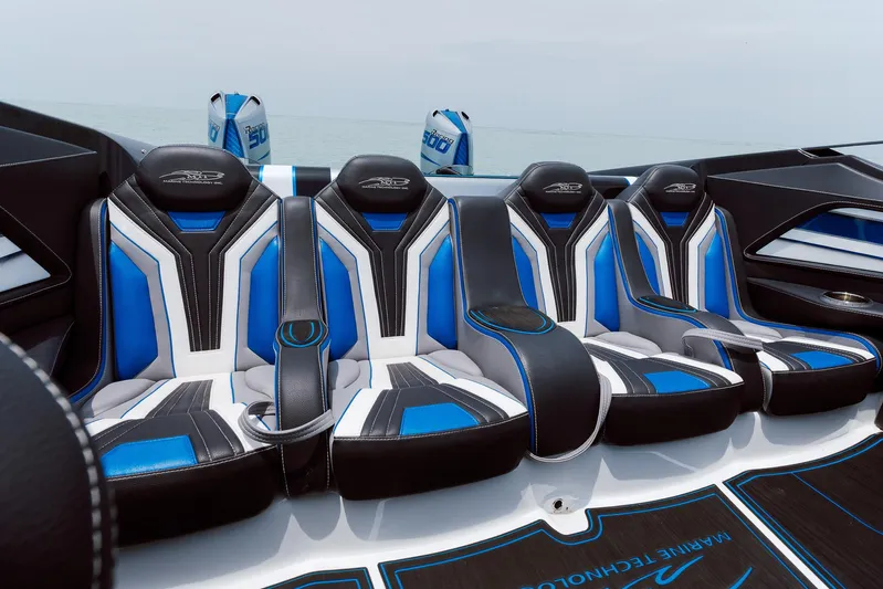  Yacht Photos Pics 2024 MTI 440X boat interior with blue and white luxury seating.