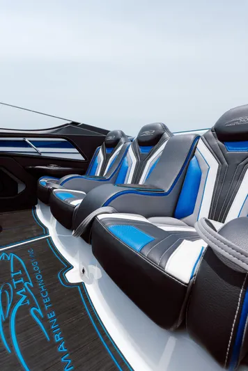  Yacht Photos Pics 2024 MTI 440X boat interior with sleek blue and white seating design.