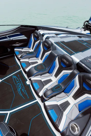  Yacht Photos Pics 2024 MTI 440X boat interior with sleek, modern seating and blue accents.