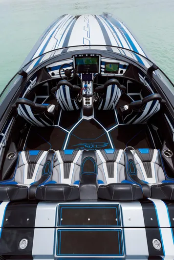  Yacht Photos Pics 2024 MTI 440X speedboat interior with modern design and advanced navigation systems.