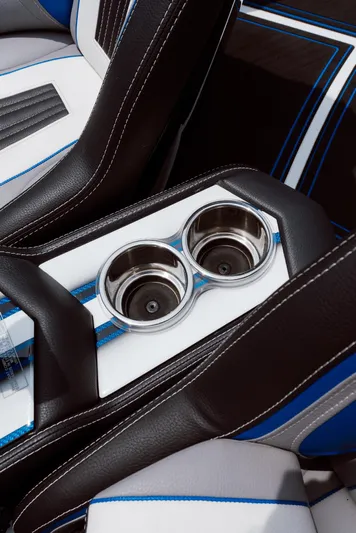  Yacht Photos Pics 2024 MTI 440X interior with dual cup holders and stylish black and blue upholstery.