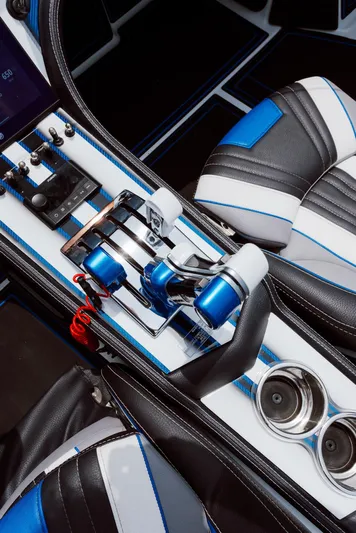  Yacht Photos Pics 2024 MTI 440X cockpit with sleek controls and blue-accented seats.