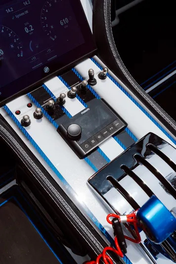  Yacht Photos Pics Control panel of 2024 MTI 440X boat with switches and display screen.