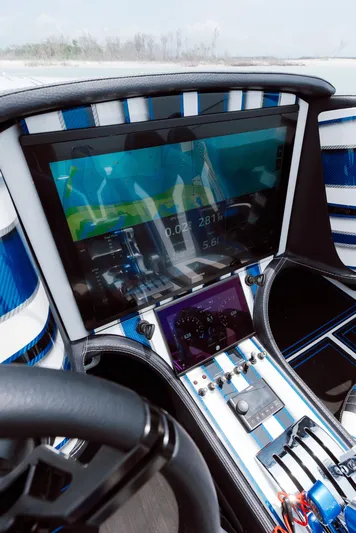  Yacht Photos Pics 2024 MTI 440X cockpit with advanced navigation display and sleek blue-white interior design.