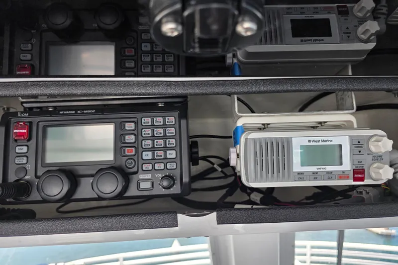 Ocean Thunder Yacht Photos Pics Marine communication equipment on a 1986 Gulf Craft Passenger vessel, featuring Icom and West Marine radios.