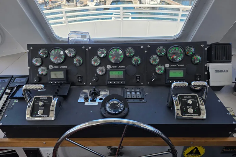 Ocean Thunder Yacht Photos Pics Control panel of a 1986 Gulf Craft Passenger boat with John Deere gauges.