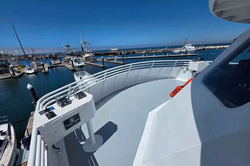 Ocean Thunder Yacht Photos Pics 1986 Gulf Craft Passenger boat docked at a marina under clear blue skies.