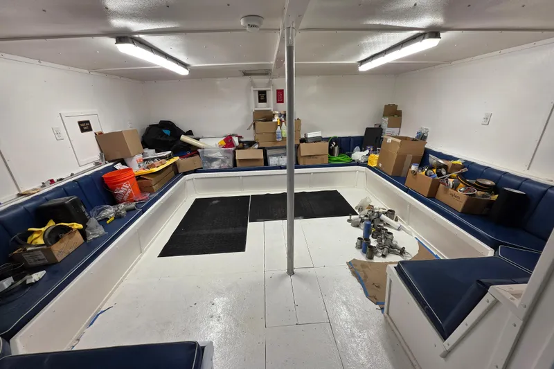 Ocean Thunder Yacht Photos Pics Interior of a 1986 Gulf Craft Passenger boat with storage boxes and equipment.