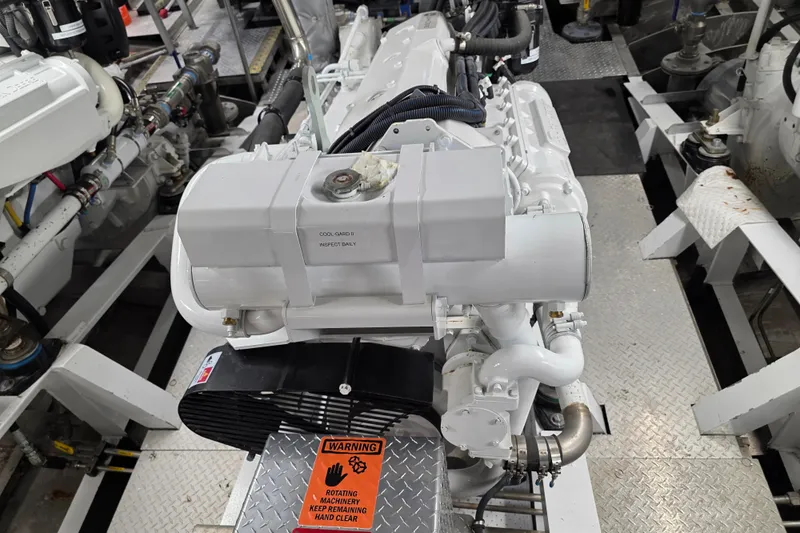 Ocean Thunder Yacht Photos Pics Engine room of 1986 Gulf Craft Passenger boat with visible machinery and safety warning.