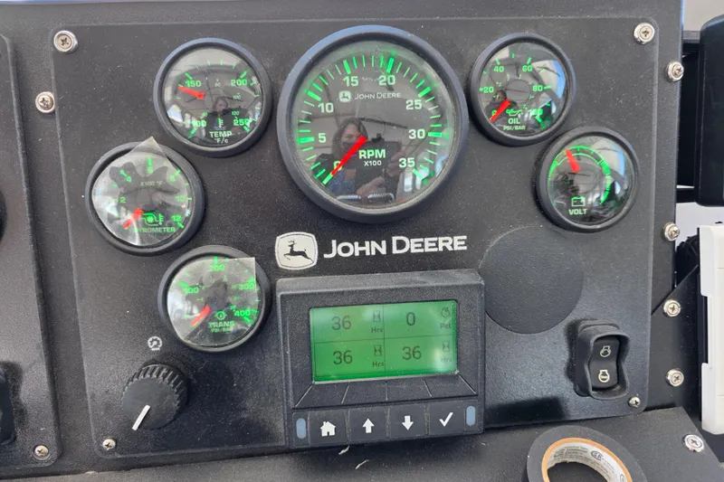 Ocean Thunder Yacht Photos Pics Control panel of a 1986 Gulf Craft Passenger boat with John Deere gauges.