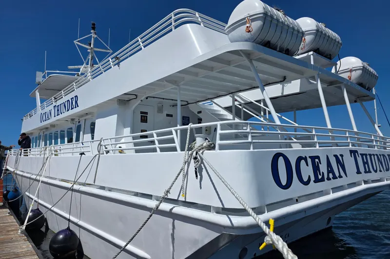 Ocean Thunder Yacht Photos Pics Gulf Craft 1986 Passenger boat "Ocean Thunder" docked, featuring lifeboats and white exterior.