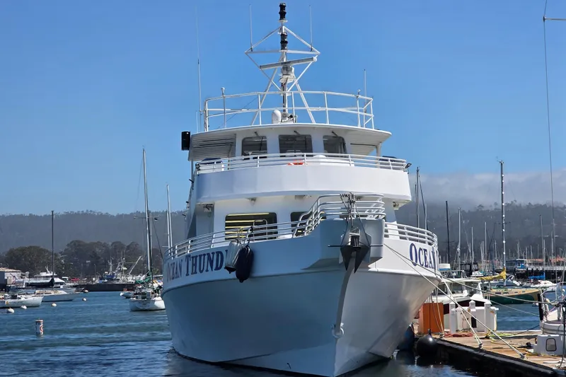 Ocean Thunder Yacht Photos Pics 1986 Gulf Craft Passenger boat docked in a marina under clear blue skies.