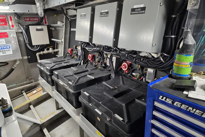 Ocean Thunder Yacht Photos Pics Engine room of a 1986 Gulf Craft Passenger boat with control panels and battery boxes.