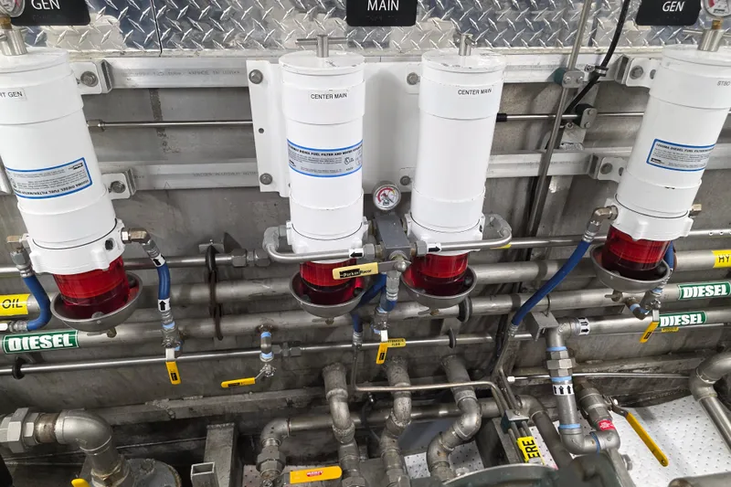 Ocean Thunder Yacht Photos Pics Engine room of 1986 Gulf Craft Passenger vessel with fuel filters and diesel pipes.