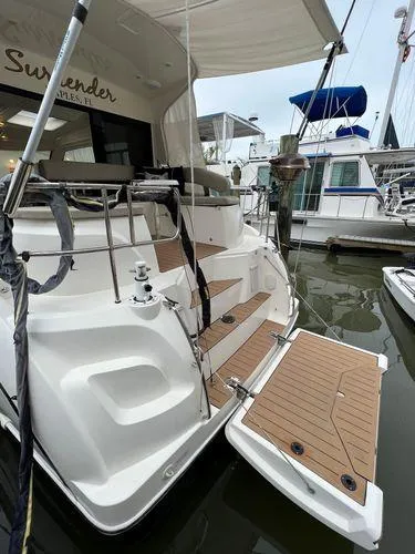  Yacht Photos Pics Luxury yacht docked at marina with wooden deck and modern design.