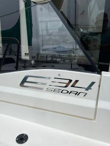  Yacht Photos Pics Bavaria E34 Sedan 2018 boat with sleek design and modern features.