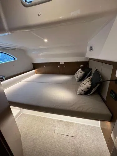  Yacht Photos Pics Luxurious Bavaria E34 Sedan 2018 cabin interior with cozy bed and modern lighting.