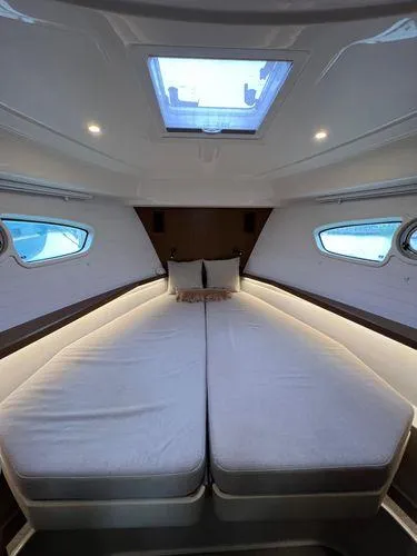  Yacht Photos Pics Luxurious Bavaria E34 Sedan 2018 interior with spacious bed and skylight.