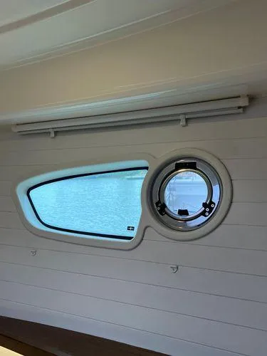  Yacht Photos Pics Interior view of Bavaria E34 Sedan 2018 with modern window design.