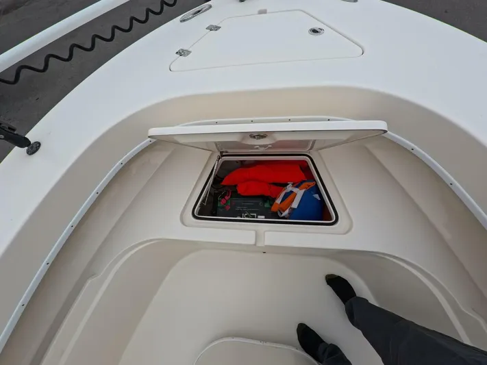  Yacht Photos Pics 2019 Young Boats 27 storage compartment with life jackets and gear.