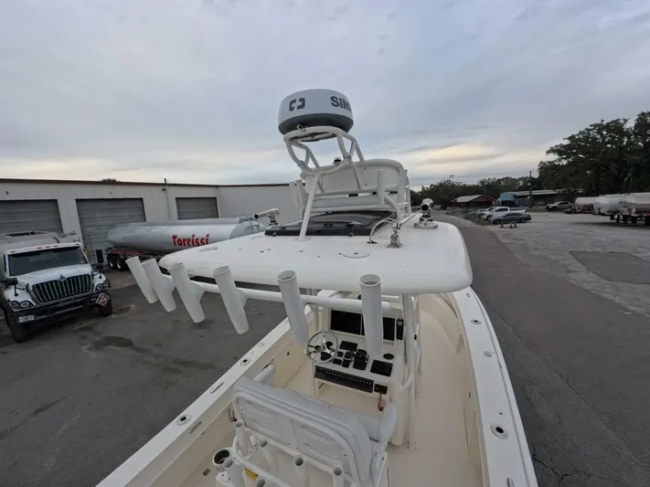  Yacht Photos Pics 2019 Young Boats 27 with radar, docked in a marina, overcast sky.