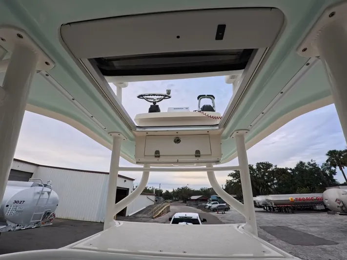  Yacht Photos Pics 2019 Young Boats 27, view of helm station and T-top structure.