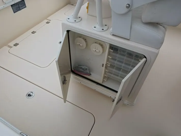  Yacht Photos Pics 2019 Young Boats 27 storage compartment with open doors and organized interior.
