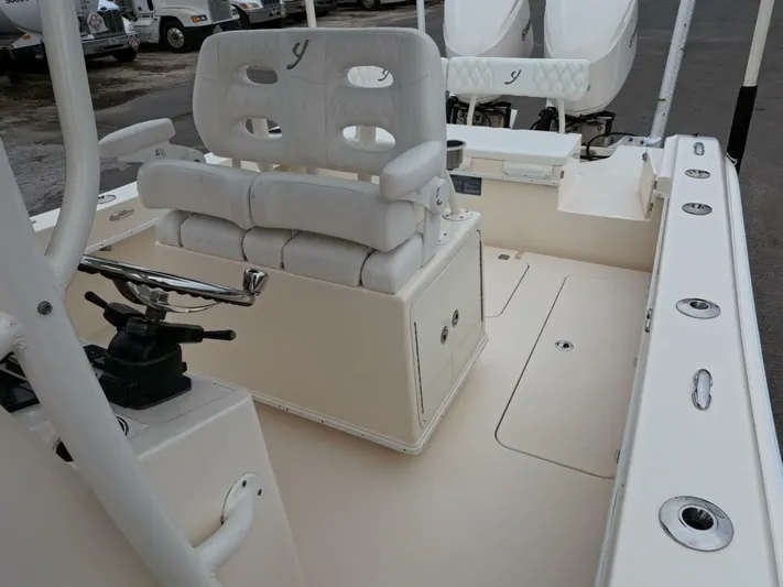  Yacht Photos Pics 2019 Young Boats 27 interior with white seating and steering console.