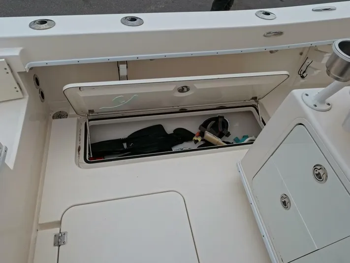  Yacht Photos Pics 2019 Young Boats 27 storage compartment with fishing gear and equipment.