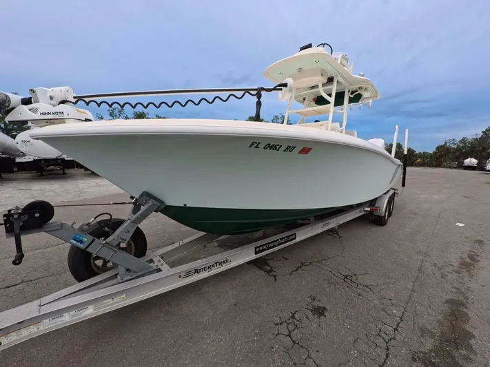  Yacht Photos Pics 2019 Young Boats 27 on trailer, parked outdoors, with clear sky background.