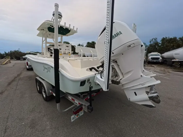  Yacht Photos Pics 2019 Young Boats 27 with Yamaha engine on trailer, parked outdoors.