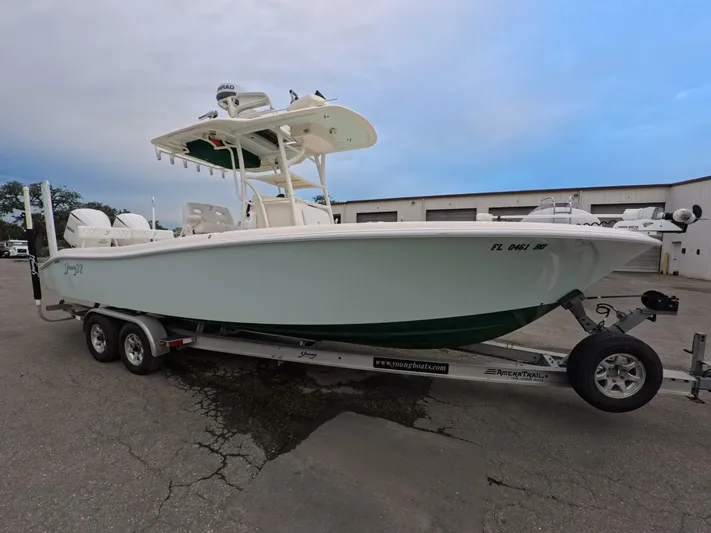  Yacht Photos Pics 2019 Young Boats 27 on trailer, parked outdoors, side view.