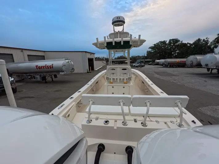  Yacht Photos Pics 2019 Young Boats 27 model at a dock with dual engines and clear sky.