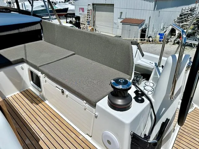 Jessy Yacht Photos Pics Jeanneau Sun Odyssey 490, 2023 model, featuring a spacious deck with cushioned seating.