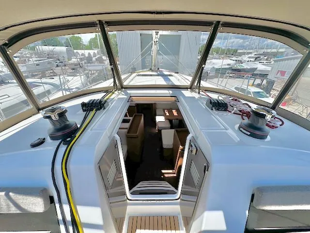 Jessy Yacht Photos Pics 2023 Jeanneau Sun Odyssey 490 yacht cockpit with open cabin view.
