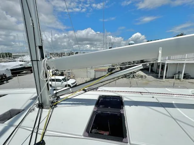 Jessy Yacht Photos Pics 2023 Jeanneau Sun Odyssey 490 sailboat deck with mast and rigging under blue sky.