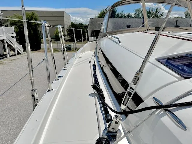 Jessy Yacht Photos Pics 2023 Jeanneau Sun Odyssey 490 sailboat deck, showcasing sleek design and modern features.