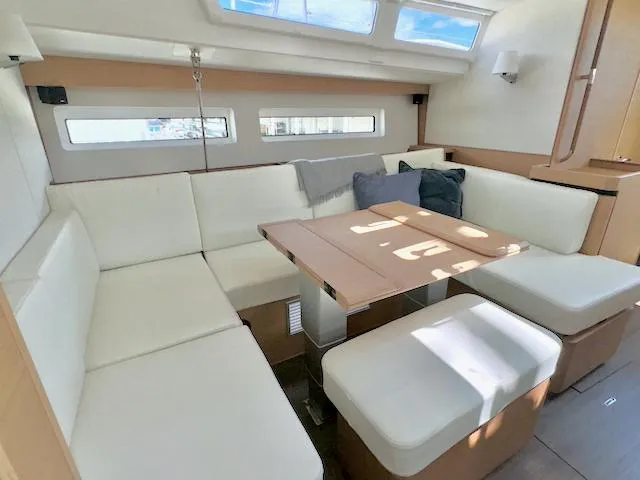 Jessy Yacht Photos Pics Interior of 2023 Jeanneau Sun Odyssey 490, featuring a modern, spacious seating area.