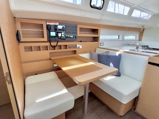 Jessy Yacht Photos Pics Interior of 2023 Jeanneau Sun Odyssey 490 yacht with modern seating and navigation equipment.