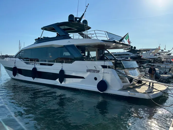  Yacht Photos Pics 2025 Astondoa AS 8 luxury yacht docked in a marina under clear blue skies.