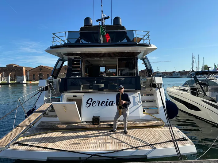  Yacht Photos Pics 2025 Astondoa AS 8 yacht docked, featuring a spacious deck and modern design.