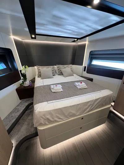  Yacht Photos Pics Luxurious bedroom interior of 2025 Astondoa AS 8 yacht with modern design and ambient lighting.