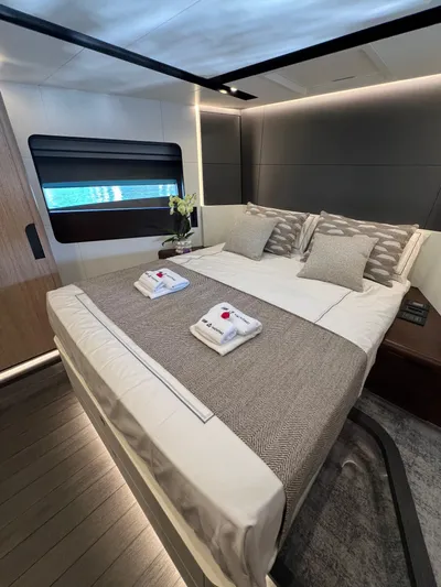  Yacht Photos Pics Luxurious bedroom interior of 2025 Astondoa AS 8 yacht with elegant bedding and modern design.