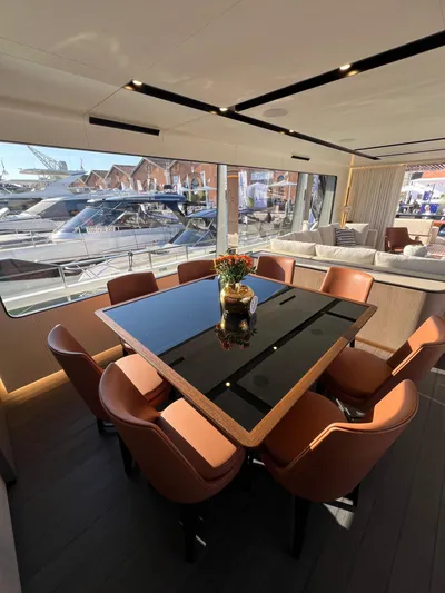  Yacht Photos Pics Luxurious interior of 2025 Astondoa AS 8 yacht with elegant dining area and marina view.