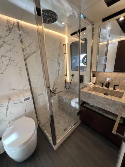  Yacht Photos Pics Luxurious bathroom in 2025 Astondoa AS 8 yacht with marble accents and modern fixtures.