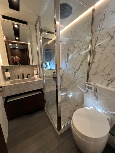  Yacht Photos Pics Luxurious bathroom in 2025 Astondoa AS 8 yacht with marble accents and modern fixtures.