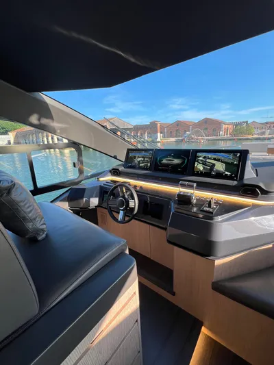  Yacht Photos Pics Luxurious 2025 Astondoa AS 8 yacht cockpit with modern navigation displays and sleek design.