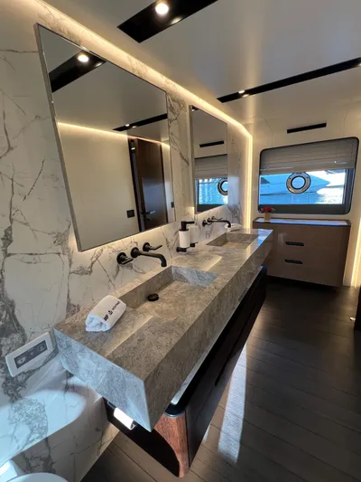  Yacht Photos Pics Luxurious bathroom in 2025 Astondoa AS 8 yacht with marble countertops and modern fixtures.