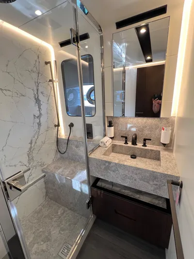  Yacht Photos Pics Luxurious bathroom in 2025 Astondoa AS 8 yacht with marble shower and modern fixtures.